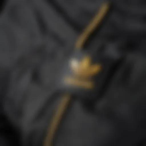 Close-up of Adidas pants with snap fasteners highlighting design