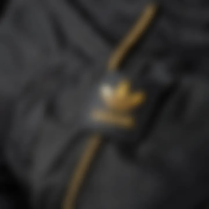 Close-up of Adidas pants with snap fasteners highlighting design