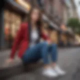 A stylish woman wearing a tailored blazer and trendy sneakers, exuding confidence in an urban setting.