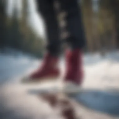 Athlete snowboarding while wearing burgundy high tops