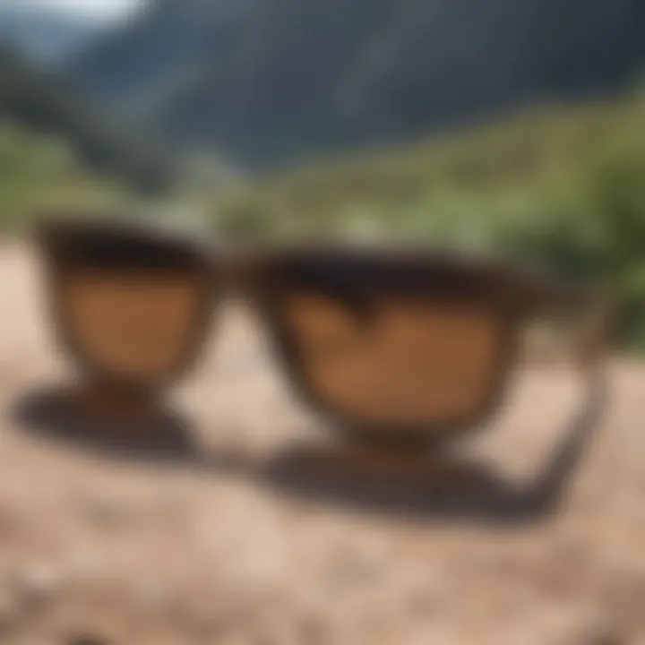 A pair of camo Holbrook sunglasses against a scenic outdoor backdrop