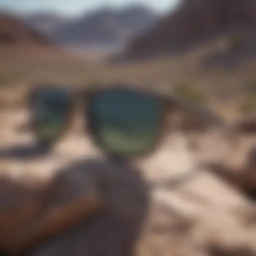 Stylish camo Holbrook sunglasses resting on a rocky surface