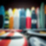 Diverse Selection of Used Inflatable Paddle Boards An array of used inflatable stand up paddle boards with varying colors and designs