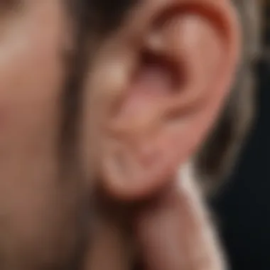 Close-up of ear with a warm compress applied