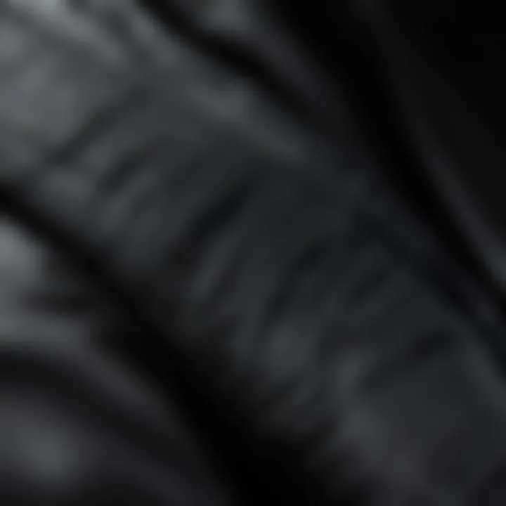 Close-up view of the technical fabric and stitching details of a black Nike jacket