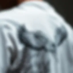 A close-up of a white graphic T-shirt featuring intricate designs that symbolize freedom and individuality