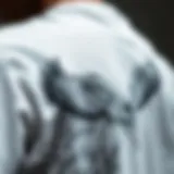 Intricate White Graphic Designs Symbolizing Individuality A close-up of a white graphic T-shirt featuring intricate designs that symbolize freedom and individuality