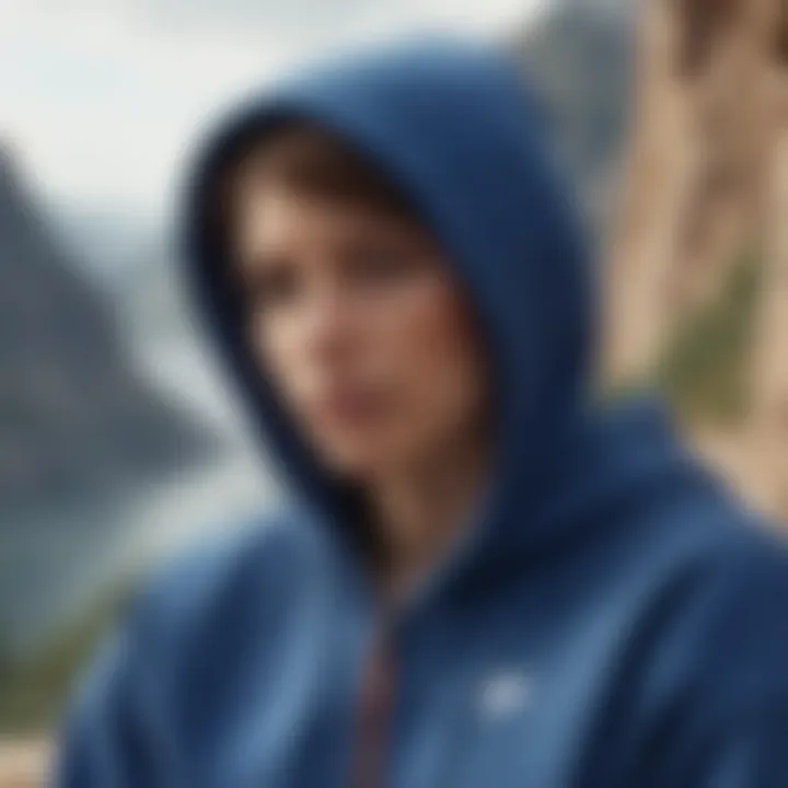 A serene outdoor scene featuring an athlete relaxing in a blue Nike pullover hoodie after an intense rock climbing session.