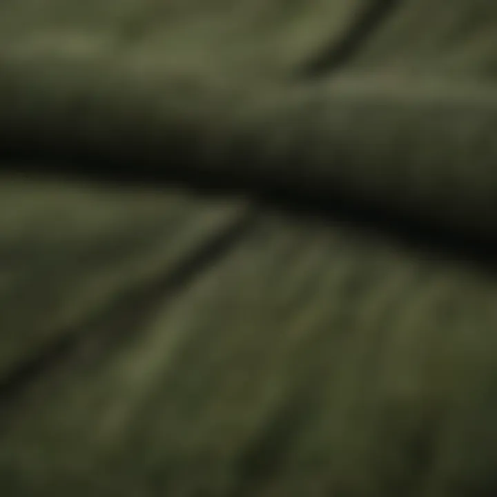 Close-up of the durable fabric and stitching of Dickies green corduroy pants, highlighting quality and craftsmanship.