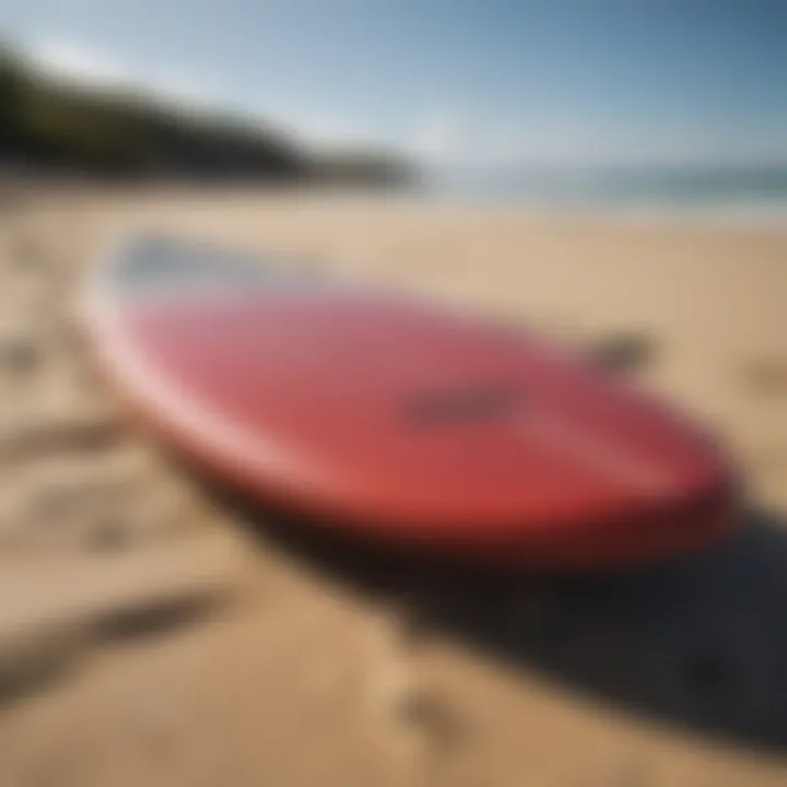 A well-maintained surfboard resting on the beach