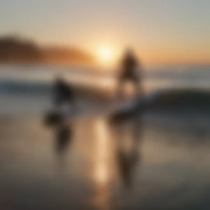 Surfers riding the waves at Malibu First Point during sunset.