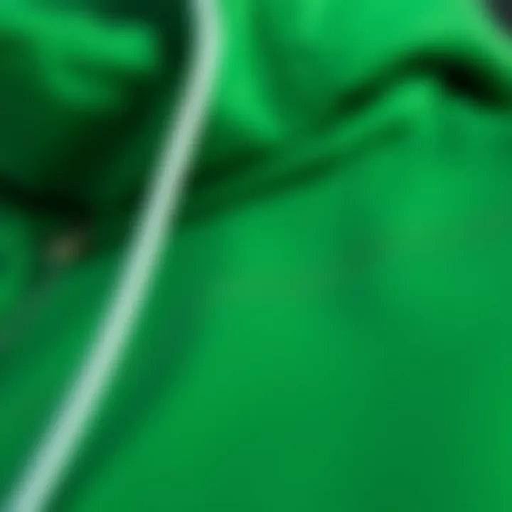 Close-up of the fabric texture of a pine green hoodie