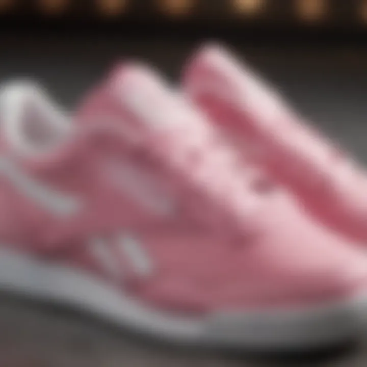 Close-up of the signature design features of pink and white Reebok Classics