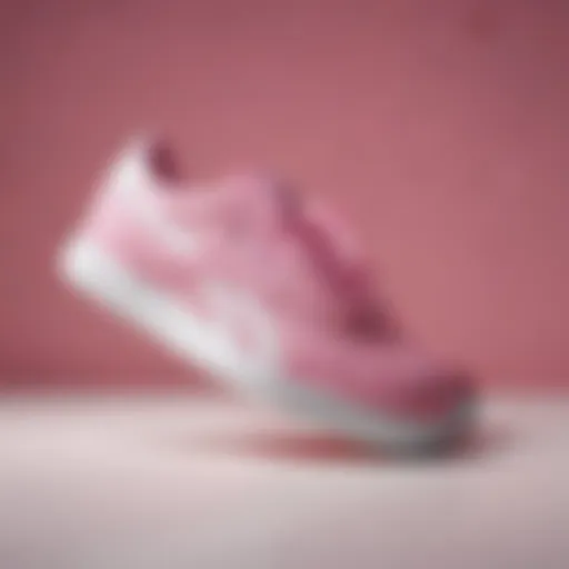 Stylish display of pink and white Reebok Classics sneakers on a vibrant background