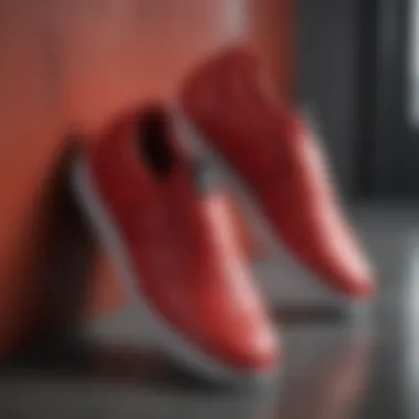 Close-up view of red Adidas slip-on shoes showcasing their sleek design and material quality.