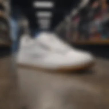 Reebok Club C Double White & Black shoes on display among extreme sports gear.