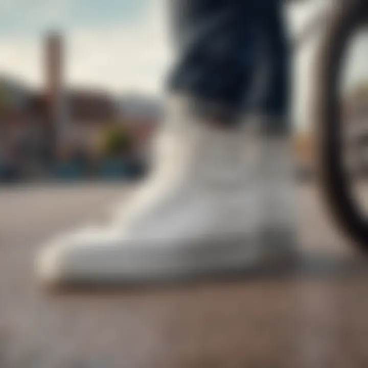 Close-up of white checkered high top Vans on a BMX bike