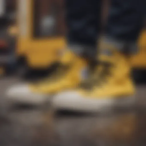 Stylish black and yellow Chuck Taylor sneakers on a vibrant urban background