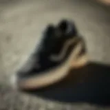 Stylish black suede Vans placed on a textured surface