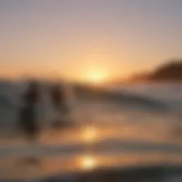 A vibrant sunset casting golden hues over surfers catching waves on boogie boards.