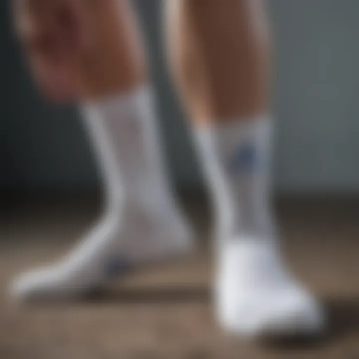 Detailed view of the design features of white Adidas socks.