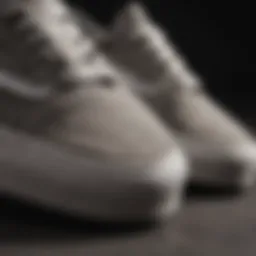 Close-up view of grey suede Vans showcasing their texture and craftsmanship.