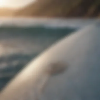 Close-up of surfboard and ocean