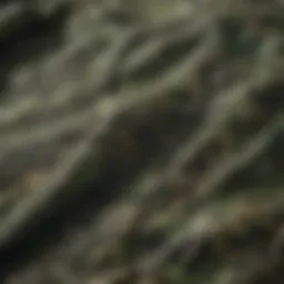 A close-up of a green camouflage t-shirt showcasing its intricate patterns and fabric texture.