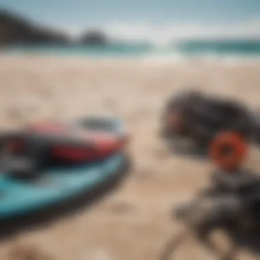 Close-up of specialized kiteboarding gear laid out on the beach