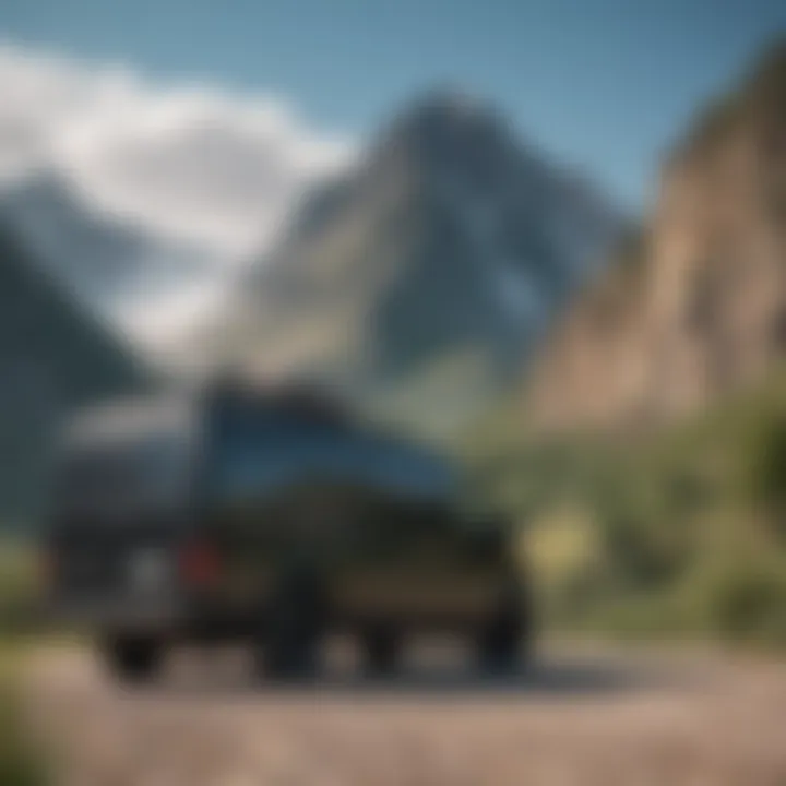 A sleek stacked black van parked near a mountain range