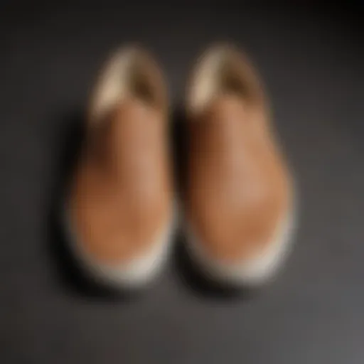 A close-up view of tan Vans slip-ons showcasing their texture and design.