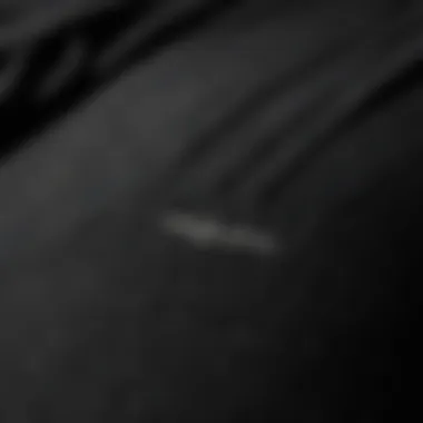 Quality Fabric Texture of Adidas Pants Close-up of the fabric texture of all black Adidas pants highlighting quality.