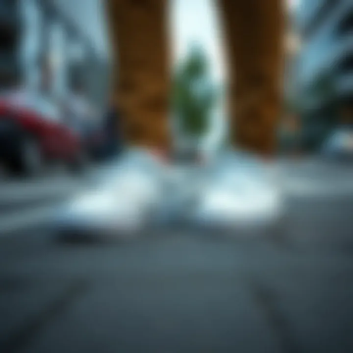 Fashionable Vans Era White Leather shoes on urban pavement