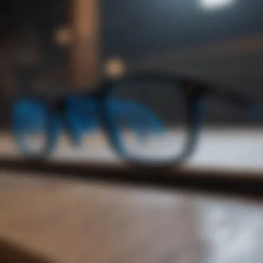 A close-up of black blue light glasses resting on a skateboard