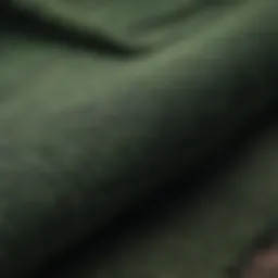 A close-up of green flannel fabric showcasing its texture and weave