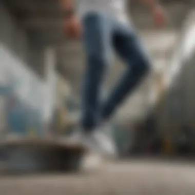 A skateboarder wearing grey and white Vans slip-ons performing a trick