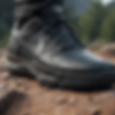 Close-up view of black Nike shoes on rugged terrain