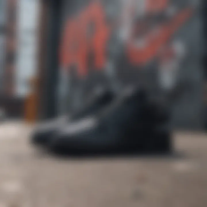 Stylish black Nike shoes displayed against an urban graffiti backdrop