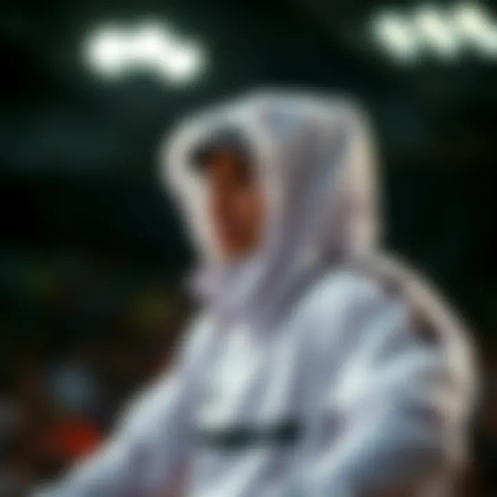 Athlete in Action with Windbreaker An athlete wearing a white hooded windbreaker during an extreme sports event