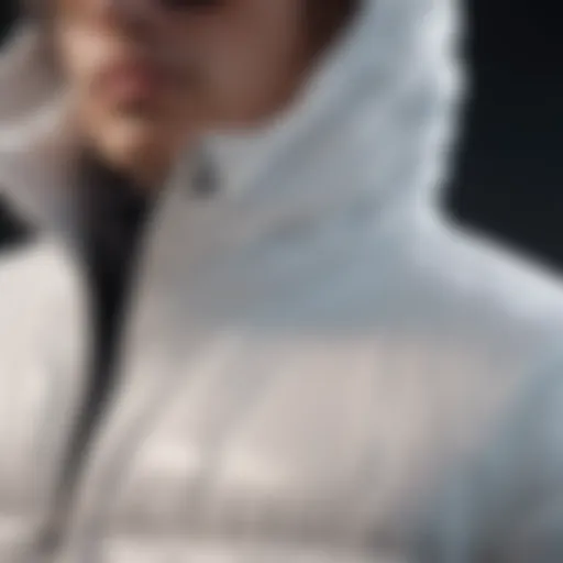 Close-up of the white puffer jacket showcasing its material texture