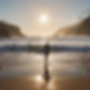 A serene beach setting with surfers preparing for the waves