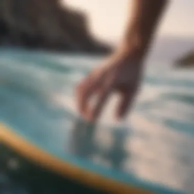 A close-up of proper installation techniques for FCS traction pads on a surfboard.