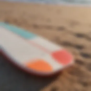 Foam Short Board on the Beach A vibrant foam short board resting on the sandy beach, showcasing its design and color.